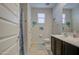 This bathroom features a single sink vanity, toilet, shower, and tropical decor for a relaxing vibe at 1280 W Blue Ridge Dr, San Tan Valley, AZ 85140