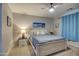Serene bedroom with a ceiling fan, neutral paint, and comfortable furnishings at 1280 W Blue Ridge Dr, San Tan Valley, AZ 85140