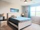Cozy bedroom featuring a queen bed, two nightstands, and a light-filled window at 1280 W Blue Ridge Dr, San Tan Valley, AZ 85140