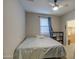 This bedroom has neutral walls, a ceiling fan, a window, and closet for storage at 1280 W Blue Ridge Dr, San Tan Valley, AZ 85140