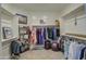 Spacious walk-in closet with built-in shelving and ample storage space at 1280 W Blue Ridge Dr, San Tan Valley, AZ 85140