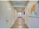 Inviting hallway with hard wood floors, clean white doors, and an eye-catching world map on the wall at 1280 W Blue Ridge Dr, San Tan Valley, AZ 85140
