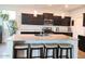 Modern kitchen featuring a large island with seating, stainless appliances, and pendant lighting at 1280 W Blue Ridge Dr, San Tan Valley, AZ 85140