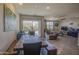Bright living room featuring a large sliding glass door to the backyard and comfortable seating at 1280 W Blue Ridge Dr, San Tan Valley, AZ 85140