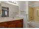 This bathroom features a single sink vanity, a standard mirror, and a shower-tub combo at 13284 W Aleppo Dr, Sun City West, AZ 85375