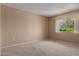 Cozy bedroom with carpet flooring, neutral walls, and a window with natural light at 13284 W Aleppo Dr, Sun City West, AZ 85375