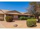 Beautiful front exterior of home boasting rock landscaping and lush shrubbery, creating a welcoming and picturesque entrance at 13284 W Aleppo Dr, Sun City West, AZ 85375