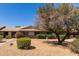 Inviting single-story home with well-maintained front yard and mature tree, offering a serene and welcoming curb appeal at 13284 W Aleppo Dr, Sun City West, AZ 85375