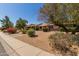 Lovely single-Gathering home with a manicured front yard, featuring colorful bushes and a mature tree for added charm at 13284 W Aleppo Dr, Sun City West, AZ 85375