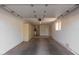 Inside the garage, there's a well-lit area with shelving and a single window at 13284 W Aleppo Dr, Sun City West, AZ 85375