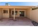A covered patio has a serving window, and a sliding glass door that opens to the home's interior at 13284 W Aleppo Dr, Sun City West, AZ 85375