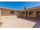 A spacious outdoor patio is connected to the home with a door and large serving window at 13284 W Aleppo Dr, Sun City West, AZ 85375