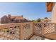 Community view from the balcony, surrounded by a wooden railing at 1633 E Lakeside Dr # 106, Gilbert, AZ 85234