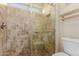 Bathroom shower with tile surround, glass door, and convenient grab bars at 1633 E Lakeside Dr # 106, Gilbert, AZ 85234