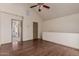 Cozy bedroom featuring wood floors, ceiling fan, and ample natural light creating a serene and inviting atmosphere at 1633 E Lakeside Dr # 106, Gilbert, AZ 85234