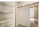 Walk-in closet with built-in shelving and ample storage space at 1633 E Lakeside Dr # 106, Gilbert, AZ 85234