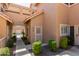 Charming townhome featuring a welcoming entrance, well-manicured landscaping, and a friendly 'Welcome' door mat at 1633 E Lakeside Dr # 106, Gilbert, AZ 85234