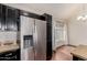 Well-lit kitchen with granite countertops, stainless steel appliances, and dark cabinets at 1633 E Lakeside Dr # 106, Gilbert, AZ 85234