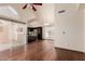 Spacious living area featuring vaulted ceilings, wood flooring, and sliding glass doors to patio at 1633 E Lakeside Dr # 106, Gilbert, AZ 85234