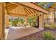 Inviting outdoor seating area with shade and wrought iron fencing, ideal for relaxing or entertaining guests at 1633 E Lakeside Dr # 106, Gilbert, AZ 85234