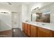 Clean bathroom with dual sinks, vanity, and walk in shower at 16564 W Wild Horse Way, Surprise, AZ 85387