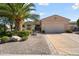 Charming single-story home featuring a desert landscape and a spacious two-car garage at 16564 W Wild Horse Way, Surprise, AZ 85387
