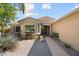 Inviting single-story home with a meticulously maintained desert landscape and bay window at 16564 W Wild Horse Way, Surprise, AZ 85387