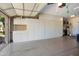 Spacious garage featuring ample white built-in storage cabinets for organization and convenience at 16564 W Wild Horse Way, Surprise, AZ 85387
