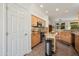 Well-appointed kitchen with light wood cabinets, granite countertops, and modern appliances at 16564 W Wild Horse Way, Surprise, AZ 85387