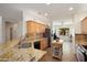 Well-appointed kitchen featuring granite countertops, stainless steel appliances, and ample cabinet space at 16564 W Wild Horse Way, Surprise, AZ 85387
