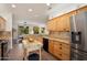 Bright, spacious kitchen with a mobile island, stainless steel appliances, and breakfast nook at 16564 W Wild Horse Way, Surprise, AZ 85387