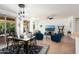 Bright and airy living room, with direct access to the covered patio, dining area and kitchen at 16564 W Wild Horse Way, Surprise, AZ 85387