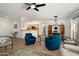 Open concept living room with tile flooring and living and dining areas at 16564 W Wild Horse Way, Surprise, AZ 85387