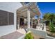 Picturesque backyard with covered patio, comfortable seating, and meticulously landscaped garden for serene outdoor enjoyment at 17637 W Browning Dr, Surprise, AZ 85374