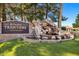 Welcome to Arizona Traditions, featuring a water feature, mature trees, and manicured lawn at 17637 W Browning Dr, Surprise, AZ 85374