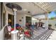 Covered patio offering a lounge and dining space, creating a perfect blend of relaxation and dining at 17637 W Browning Dr, Surprise, AZ 85374