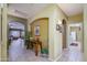 Inviting hallway with arched doorways, tile flooring, and decorative accents at 17637 W Browning Dr, Surprise, AZ 85374