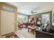 Cozy living room with a large window, comfortable seating, and a functional workspace at 17637 W Browning Dr, Surprise, AZ 85374