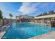 Large lap pool area featuring pool-side basketball hoops and plentiful lounge seating at 17637 W Browning Dr, Surprise, AZ 85374