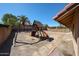 Spacious backyard features a playground, ample space, and block wall fencing at 1833 E Redfield Rd, Phoenix, AZ 85022