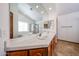 Bright bathroom features a double sink vanity, soaking tub and a separate walk-in shower at 1833 E Redfield Rd, Phoenix, AZ 85022