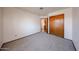 This bedroom has a closet and a door leading to another room at 1833 E Redfield Rd, Phoenix, AZ 85022