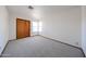 Bedroom features a window for natural light and a closet at 1833 E Redfield Rd, Phoenix, AZ 85022
