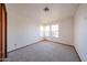 Bright bedroom with multiple windows and plush carpet throughout at 1833 E Redfield Rd, Phoenix, AZ 85022