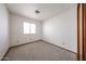 This carpeted bedroom features a window that brings in natural light at 1833 E Redfield Rd, Phoenix, AZ 85022