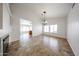 Bright, open dining area with chandelier, vaulted ceilings, tile floors, and lots of natural light at 1833 E Redfield Rd, Phoenix, AZ 85022