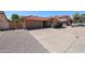 Lovely house with two-car garage, tile roof, and low-maintenance landscaping at 1833 E Redfield Rd, Phoenix, AZ 85022