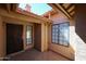 Covered front patio with security door and windows, providing curb appeal and functionality at 1833 E Redfield Rd, Phoenix, AZ 85022