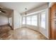 Bright eat-in kitchen area featuring large windows, neutral paint, and tile flooring at 1833 E Redfield Rd, Phoenix, AZ 85022