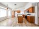 Spacious kitchen featuring wood cabinetry, tile countertops, an island, and stainless steel appliances at 1833 E Redfield Rd, Phoenix, AZ 85022